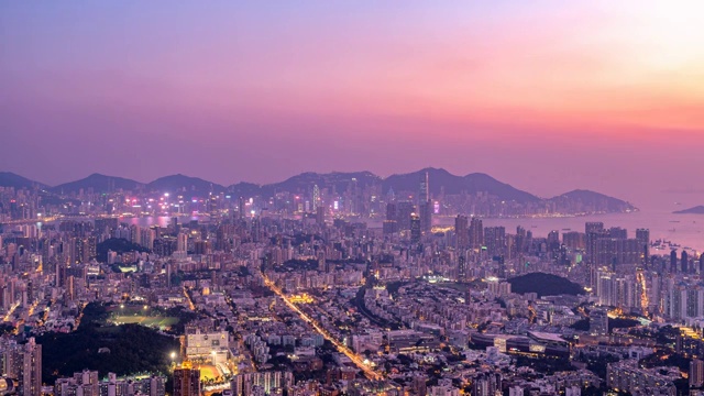 从狮子山上俯瞰中国香港城市天际线全景日转夜延时摄影视频素材
