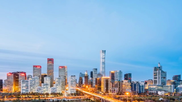 中国北京CBD建筑群和城市车流日转夜延时摄影视频素材