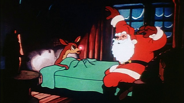 活泼的圣诞老人对躺在床上的红鼻子驯鹿鲁道夫说话/声音视频素材