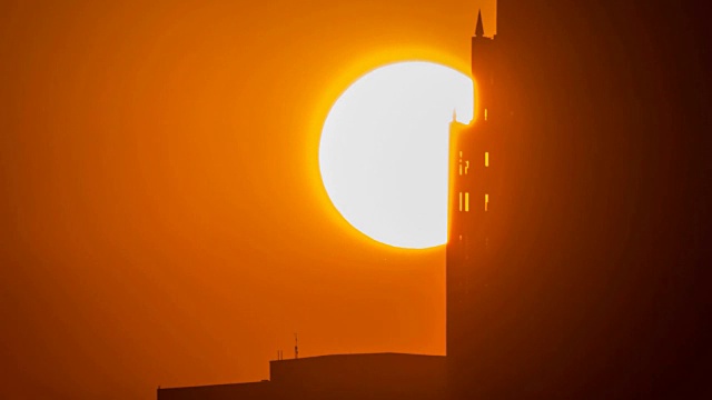 休斯顿大楼上空日出的远摄。视频素材