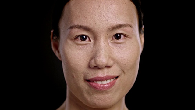 一个微笑的亚洲女人的脸视频下载