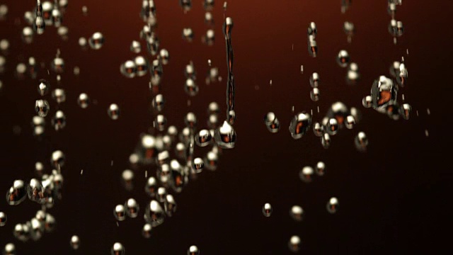 水滴落在黑色的背景上视频素材