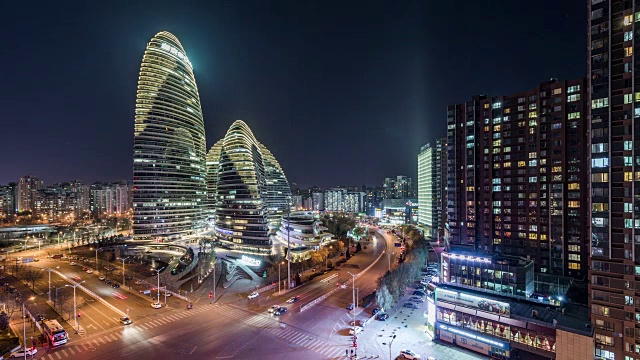 T/L HA Illuminated skyscraper(望京Soho) and Grid Apartment at night /中国北京视频素材