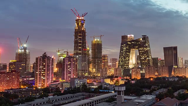 T/L MS HA PAN View of Beijing Skyline and Construction Site, Day to Night Transition /北京，中国视频素材