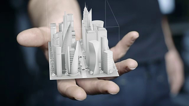 手里拿着3D城市全息图的人视频素材