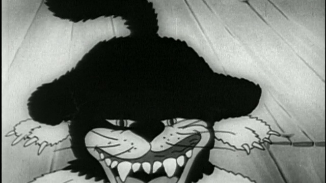 黑白1932动画特写黑猫张开的嘴/锋利的牙齿和摆动的尾巴/音频视频素材