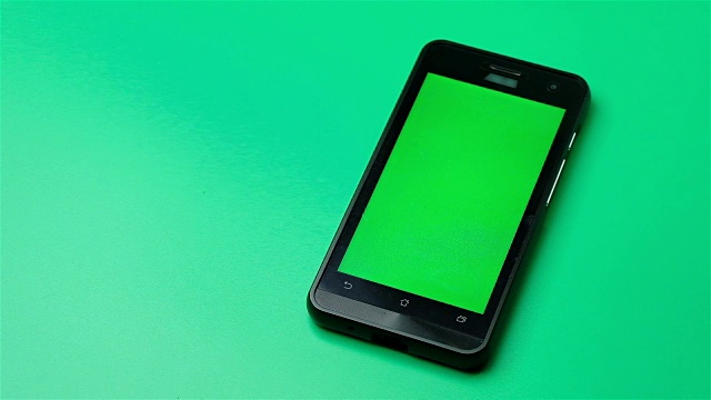 智能手机绿色背景与空白绿色屏幕视频素材