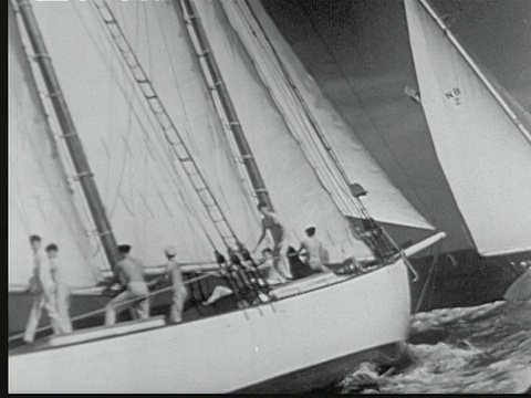 1948年B/W蒙太奇迈阿密到拿骚帆船比赛。美国佛罗里达州，大型帆船在航行中陷入水中，甲板上有船员视频下载