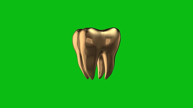 金色的人类牙齿环在绿色背景上旋转视频素材