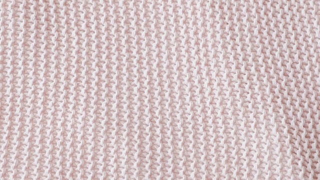 针织物的粉红色纹理。视频下载