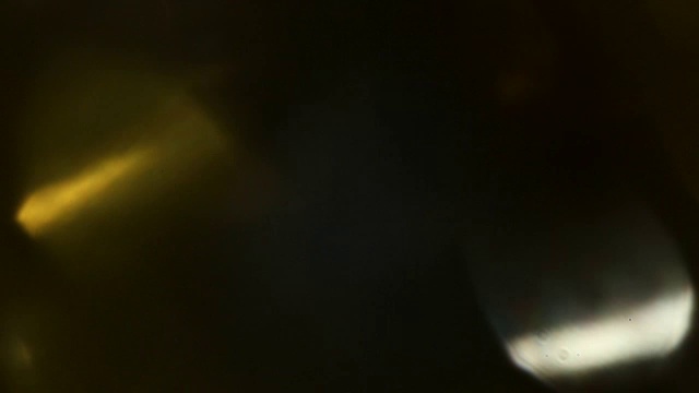 一组光漏胶片效果在黑色背景视频素材