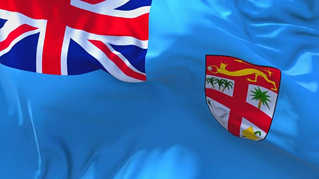 斐济在风中摇摆的慢动作动画。4K逼真的织物纹理旗帜平稳吹在一个刮风的日子连续无缝循环背景。视频下载