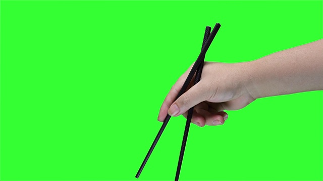 绿色屏幕背景上手持筷子视频素材