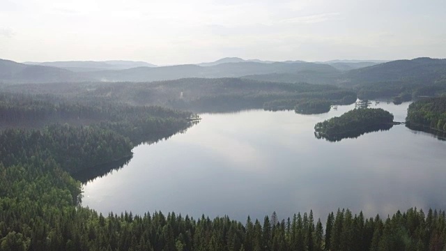 Aerial view of forest and lake in Norway.视频素材