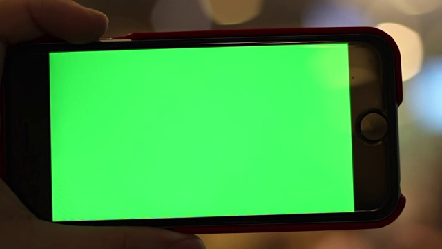 空白绿屏智能手机近距离与手视频素材
