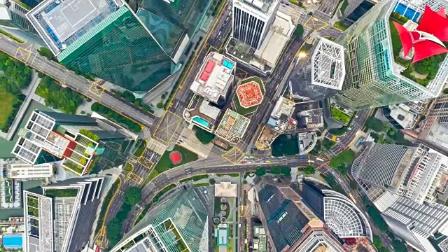 当日鸟瞰新加坡城市金融中心商务区建筑的无人机延时或延时视频下载