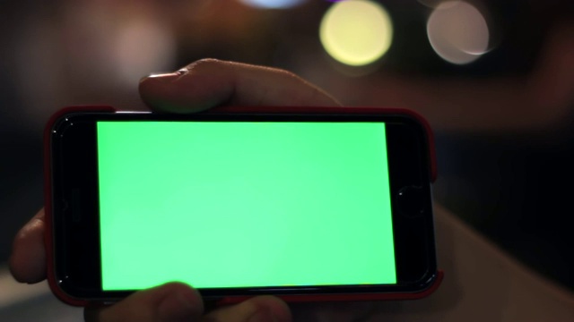 空白绿屏智能手机近距离与手视频素材