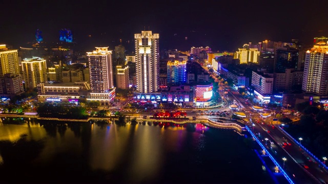 夜晚照亮三亚河交通街道航拍全景，时间跨度为4k中国视频素材