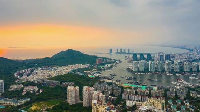 日落时间著名的三亚湾城市景观航拍全景时间间隔4k中国视频素材