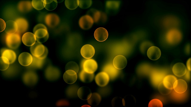 散焦粒子-黄色，橙色，绿色-可循环视频素材