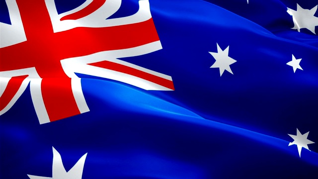 澳洲国旗视频在风中飘扬。现实的澳大利亚国旗背景。澳大利亚国旗循环特写1080p全高清1920X1080镜头。澳大利亚悉尼澳大利亚国家旗帜/其他高清旗帜可用视频下载