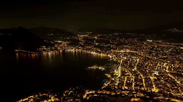 卢加诺城市灯光从白天到夜晚的时间流逝视频素材