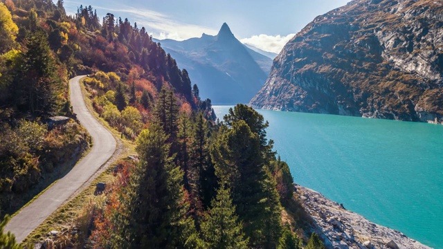 湖绿松石路山脉秋季Zervreilasee瑞士空中4k视频素材