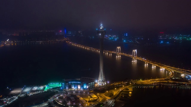 夜间时间照亮澳门城著名塔顶交通大桥道路航拍全景，4k时间跨度中国视频素材