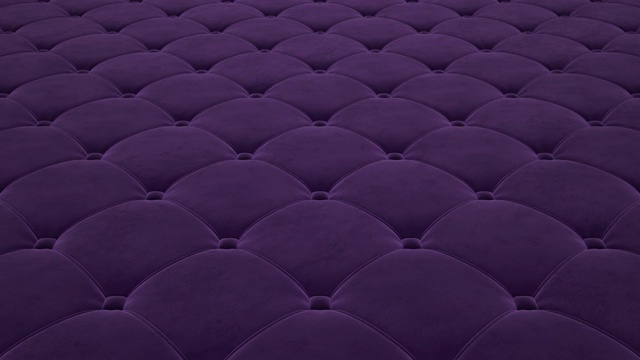 在紫色绗缝天鹅绒表面上的飞行的3D动画。毛圈的视频。视频下载