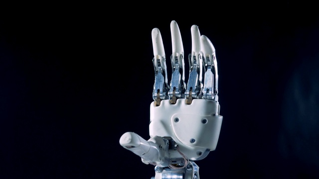自动弯曲手指，特写。未来机器人的概念。视频素材