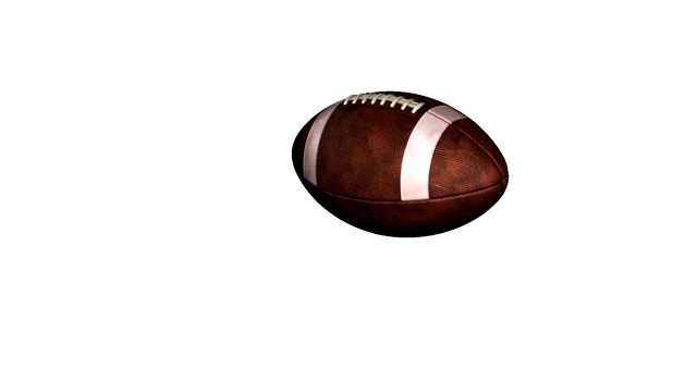 美式橄榄球在白色的背景下以慢动作飞行视频素材