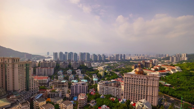 日落三亚城市景观大东海酒店屋顶全景4k时间推移海南岛中国视频素材