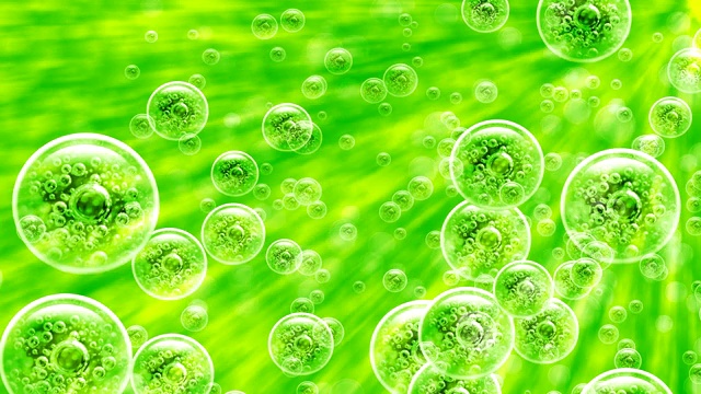 氧气气泡在绿色液体中随着射线向上涌动，与绿色液体结合。视频素材