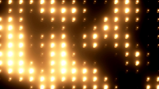 抽象的金色泛光灯照明墙可循环背景视频素材