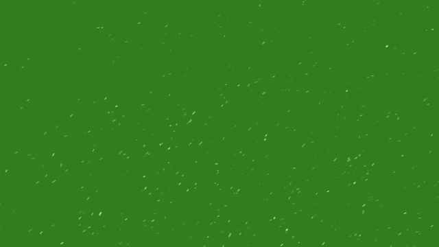 飘落的雪花颗粒在绿色的背景上闪烁。视频素材