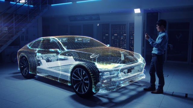 电动汽车底盘平台的汽车工程师，使用平板电脑和增强现实3D软件。创新设施:带轮子的车架成为实体虚拟模型。视频素材