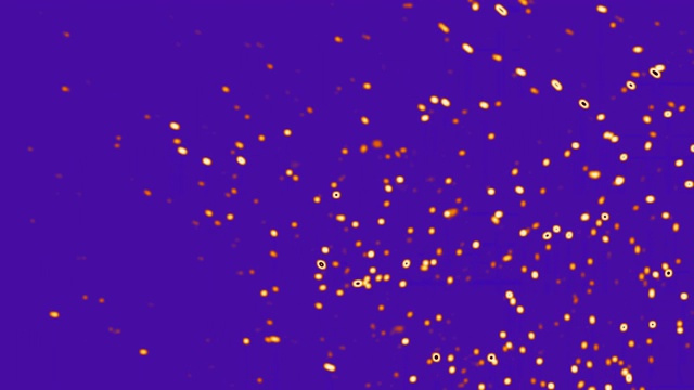 金色的细胞在紫色的背景上繁殖视频下载
