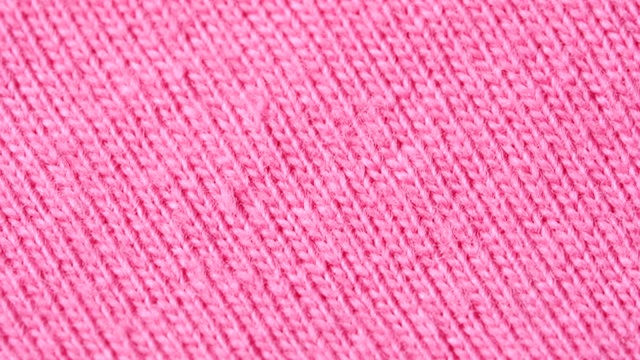 纺织品背景-粉红色100%纯棉织物，有针织物结构。视频下载
