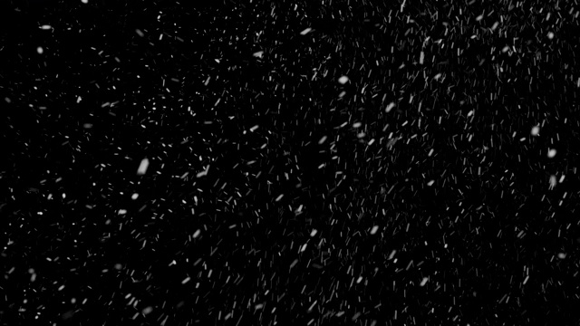 冬天真雪慢动作落地效果。暴风雪隔离在黑色背景在4K用于合成，运动图形，或作为背景或覆盖。视频素材