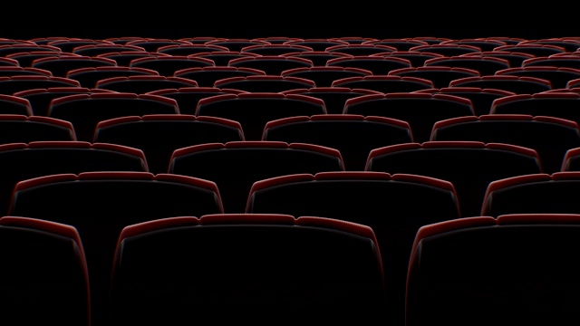 在黑色无缝屏幕的抽象电影大厅的椅子后面移动。循环3d动画一排排的座位在电影院。艺术与媒体概念。视频素材