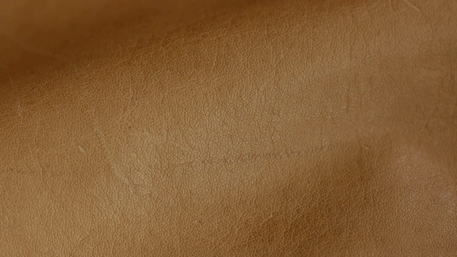 天然棕色皮革纹理背景。抽象复古牛皮背景设计。视频下载