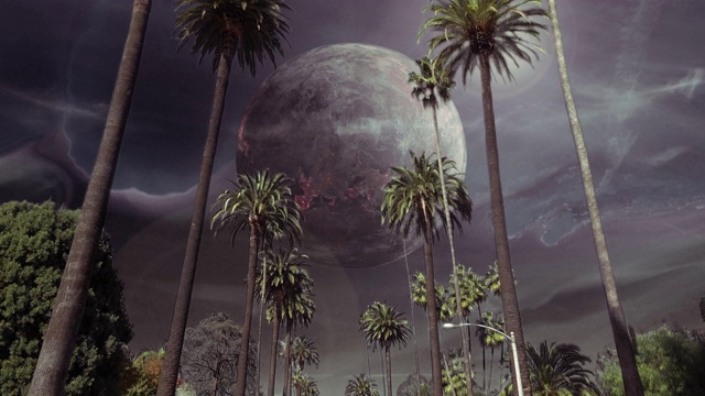 未来世界里棕榈树大道上的旋转月亮视频素材