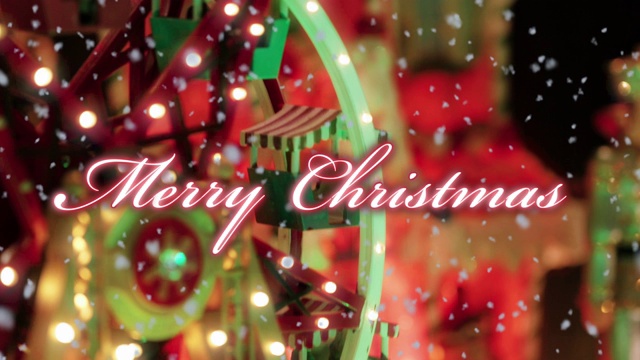 圣诞快乐的文字排版设计在红色与一个玩具大轮满灯的背景下的雪-特写视图-圣诞事件的概念视频下载