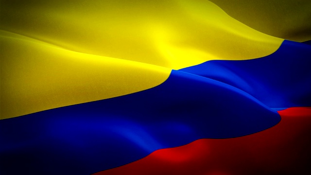 哥伦比亚国旗运动循环视频在风中飘扬。现实的哥伦比亚国旗背景。哥伦比亚旗帜循环特写1080p全高清1920X1080镜头。哥伦比亚南美国家国旗镜头视频电影，新闻视频下载