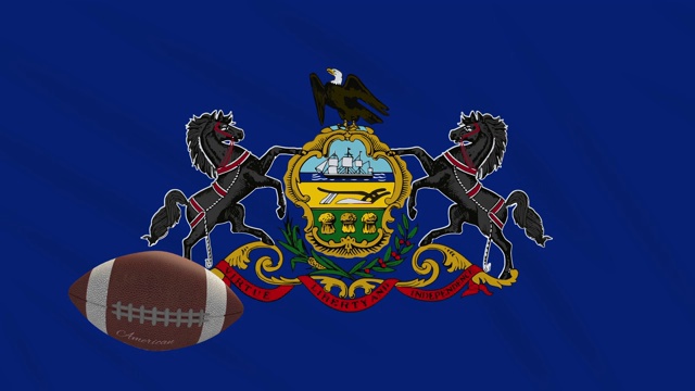 宾夕法尼亚国旗和美国足球旋转，循环视频下载