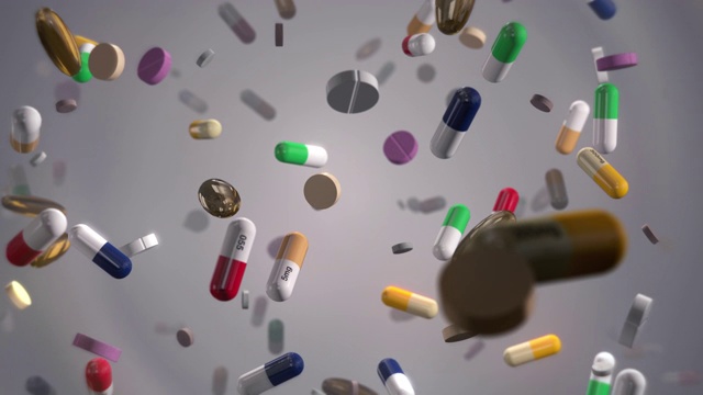 五颜六色的药丸在白色的雨视频下载