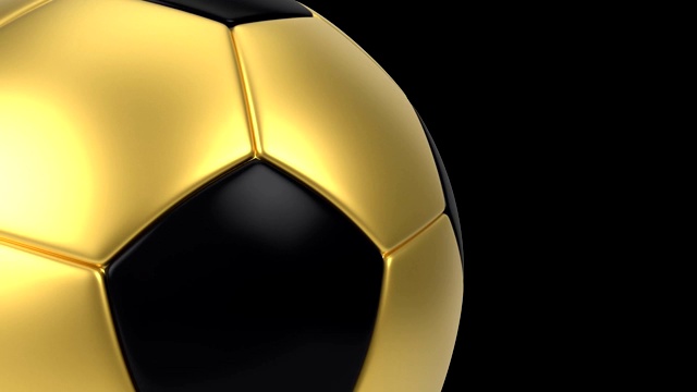 现实的黑色和金色足球孤立的黑色背景。3 d动画循环。视频下载