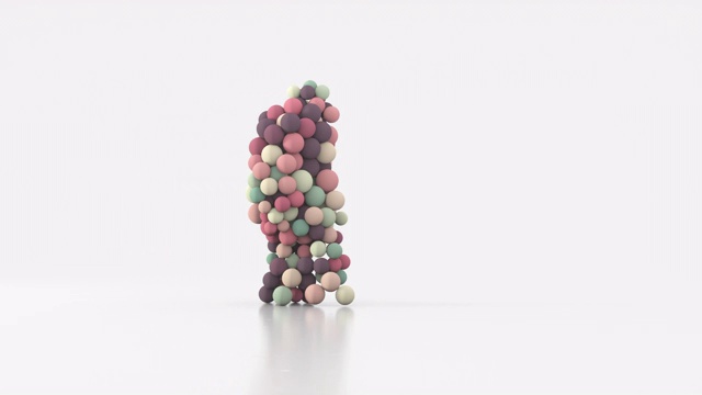 由不同大小的彩球组成的步行人的剪影。视频素材