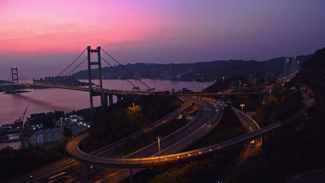 中国香港青衣区青马大桥交通的4k分辨率时间间隔。日落，黄昏视频素材
