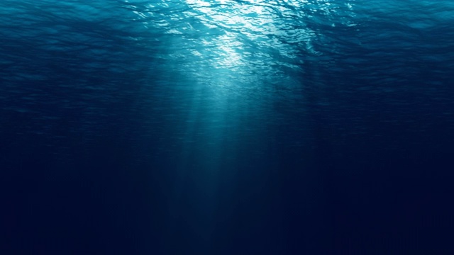 无缝循环的深蓝海浪从水下背景，光线透过视频下载